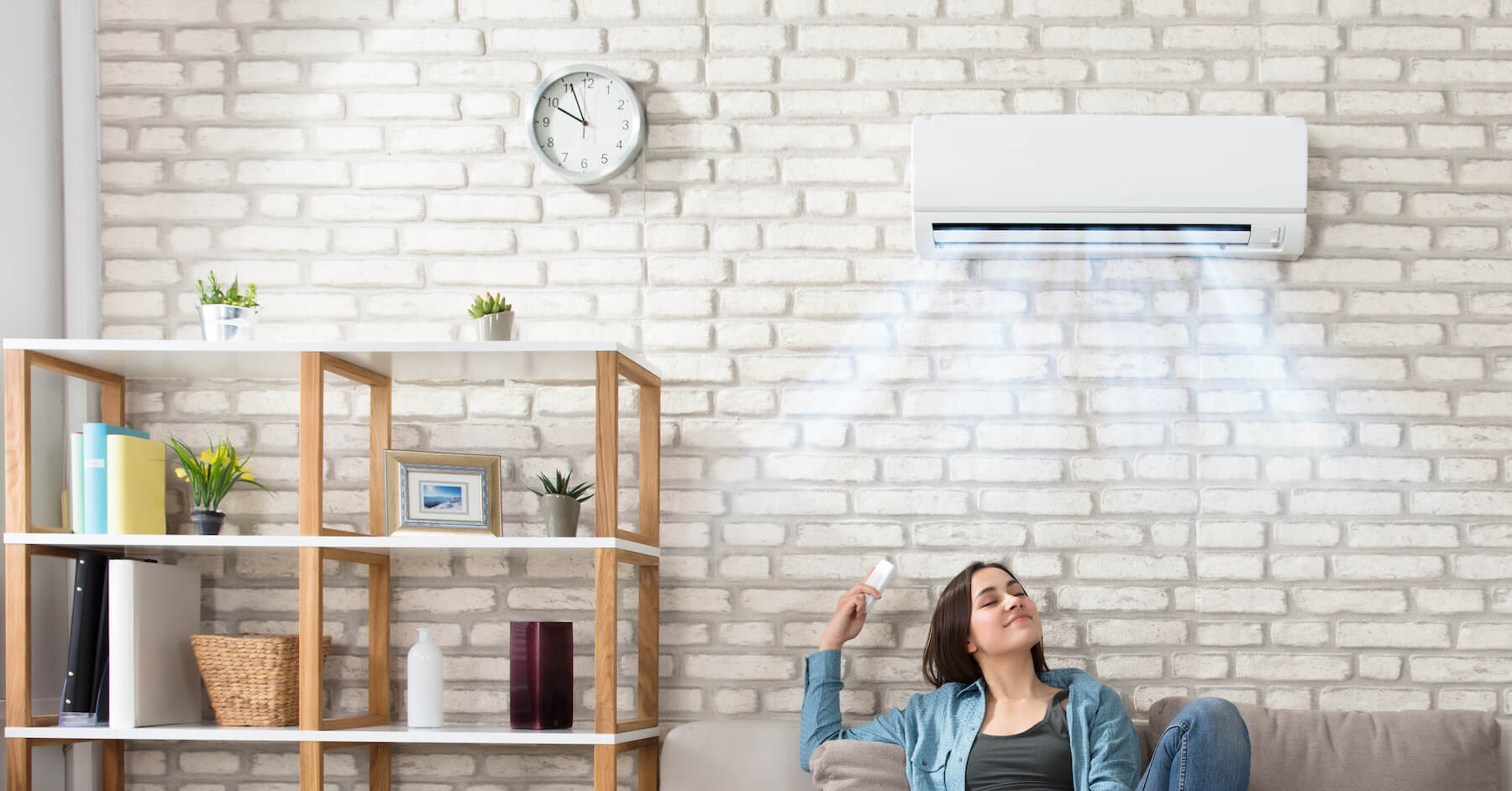 Mini split system mounted on a living room wall