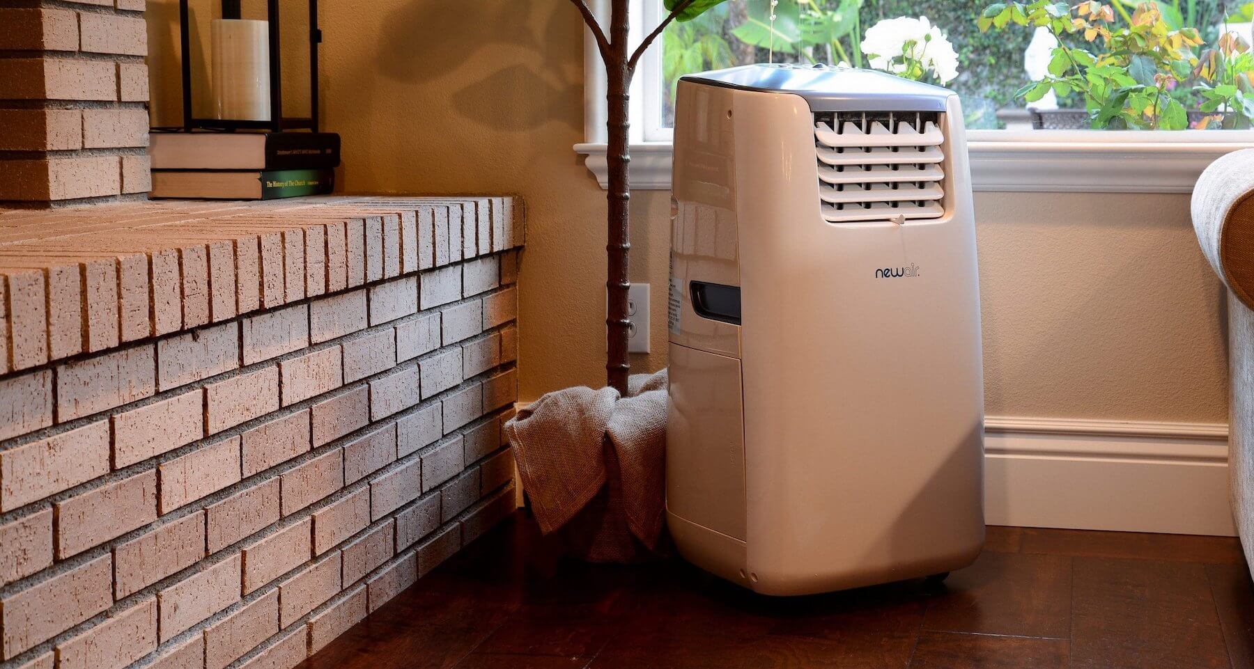 Portable air conditioner cooling a room